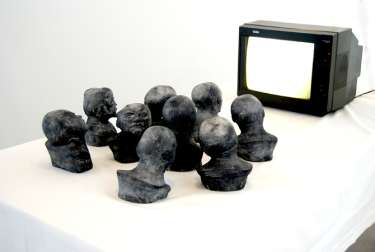 Dad bought me souvenirs from Russia with love, 2012, painted concrete, TV-screen, DVD-player, table, video loop 3 min